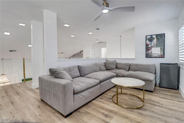 9680 Pineapple Preserve Ct, Fort Myers, FL 33908 - living room featuring light wood finished floors, a ceiling fan, baseboards, lofted ceiling, and visible vents