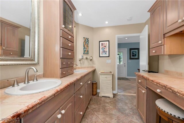 1195 Windswept Ave, Naples, FL 34109 - bathroom with double vanity, baseboards, recessed lighting, and tile patterned floors