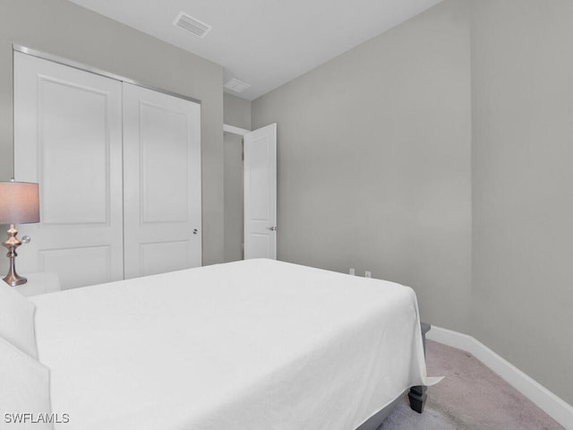 28426 Montecristo Loop, Bonita Springs, FL 34135 - carpeted bedroom with baseboards, visible vents, and a closet