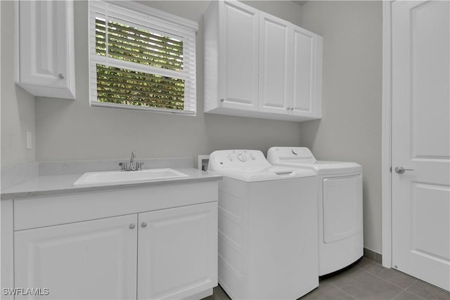 28426 Montecristo Loop, Bonita Springs, FL 34135 - washroom with a sink, tile patterned floors, cabinet space, and washer and dryer