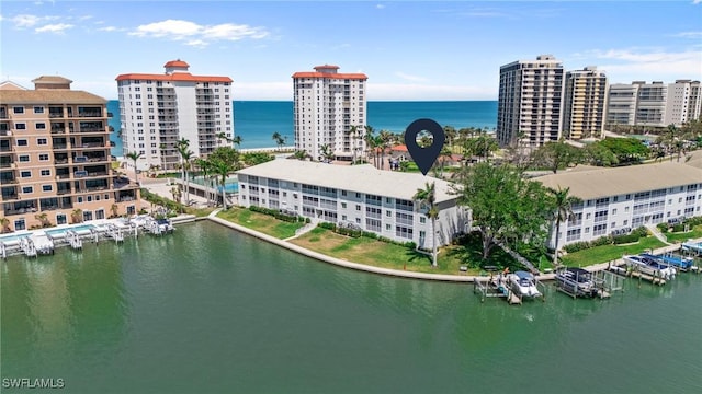 view of urban area with a large body of water