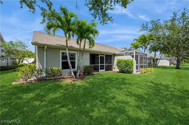 6171 Mandalay Cir Unit 28, Naples, FL 34112 - back of property with a lawn and stucco siding