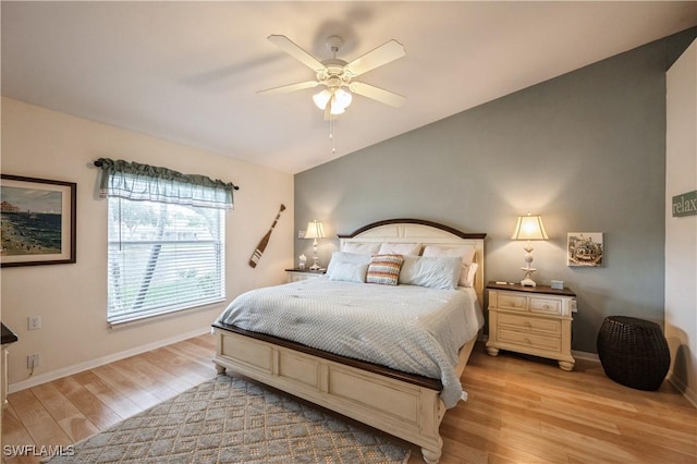 6171 Mandalay Cir Unit 28, Naples, FL 34112 - bedroom featuring light wood-type flooring, a ceiling fan, baseboards, and lofted ceiling