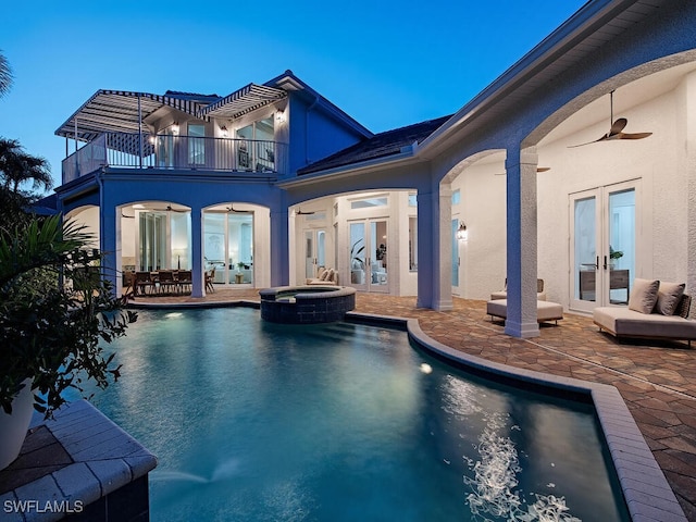 650 Bow Line Dr, Naples, FL 34103 - back of property with french doors, a balcony, stucco siding, and a ceiling fan