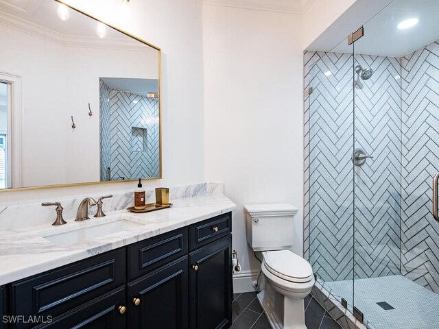650 Bow Line Dr, Naples, FL 34103 - full bath with vanity, a shower stall, crown molding, tile patterned flooring, and toilet