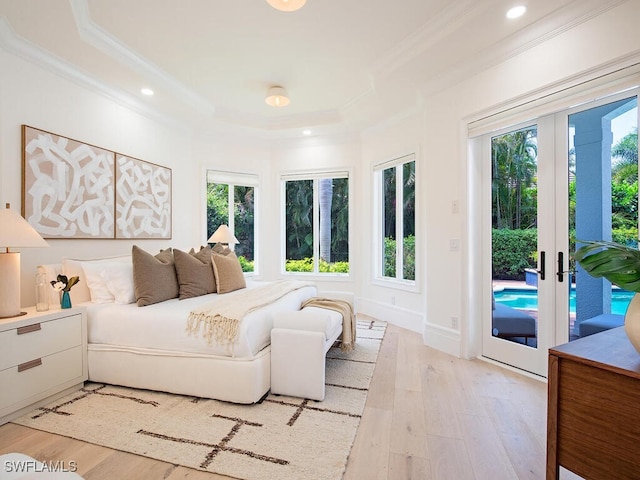 650 Bow Line Dr, Naples, FL 34103 - bedroom featuring crown molding, access to outside, light wood-type flooring, recessed lighting, and a tray ceiling