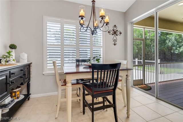 360 3rd St SW, Naples, FL 34117 - dining room with a chandelier, plenty of natural light, baseboards, and light tile patterned flooring