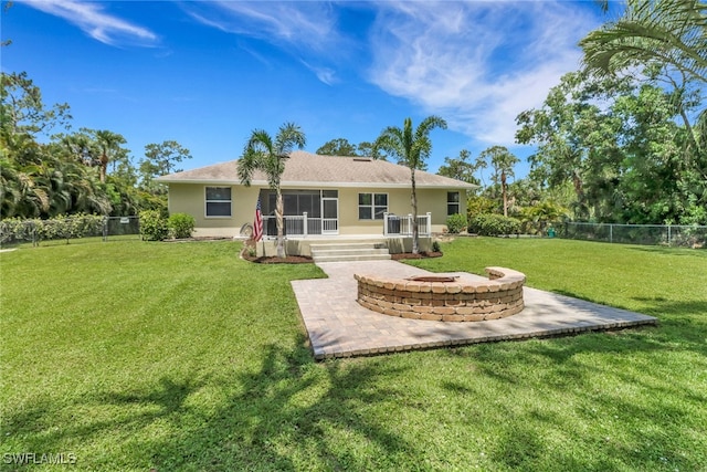 360 3rd St SW, Naples, FL 34117 - back of property featuring a patio area, a fire pit, stucco siding, and a sunroom