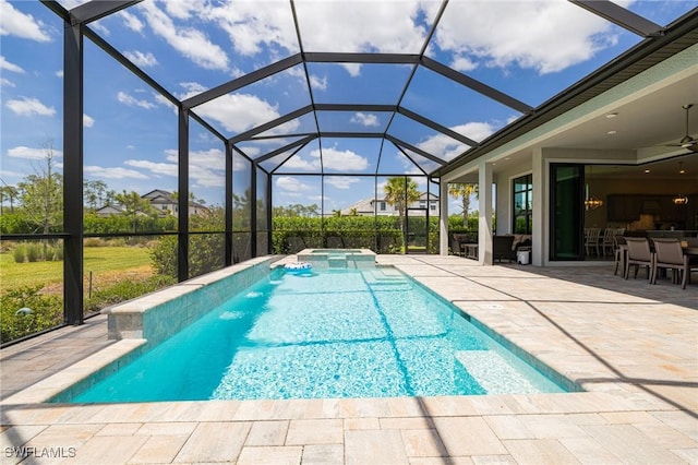 19720 Panther Island Blvd, Estero, FL 33928 - view of swimming pool with glass enclosure, a patio, ceiling fan, and a pool with connected hot tub