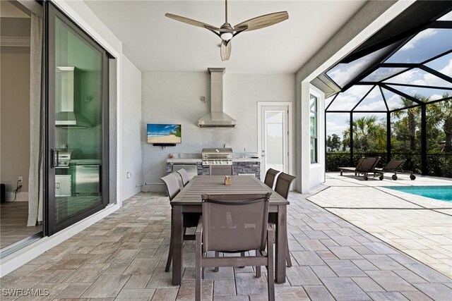 19720 Panther Island Blvd, Estero, FL 33928 - exterior space featuring grilling area, a ceiling fan, exterior kitchen, glass enclosure, and outdoor dining space