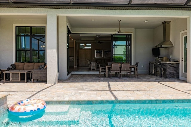 19720 Panther Island Blvd, Estero, FL 33928 - outdoor pool with a ceiling fan, outdoor dining area, a patio area, an outdoor kitchen, and outdoor lounge area