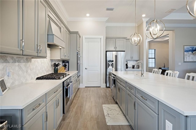 19720 Panther Island Blvd, Estero, FL 33928 - kitchen featuring visible vents, gray cabinetry, a sink, and an inviting chandelier
