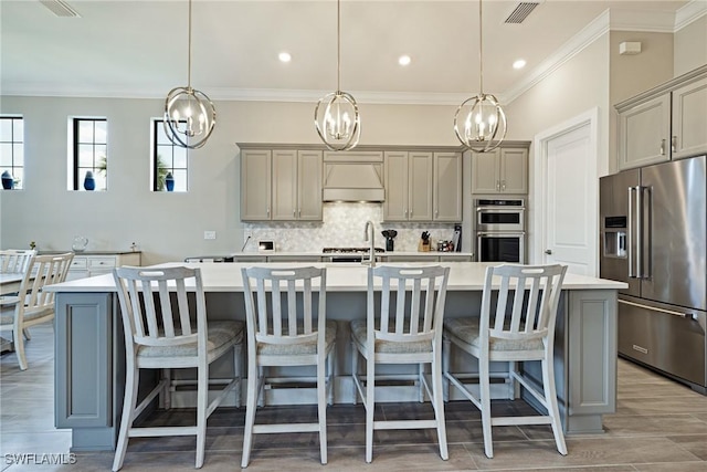 19720 Panther Island Blvd, Estero, FL 33928 - kitchen with decorative backsplash, light countertops, gray cabinets, a notable chandelier, and stainless steel appliances