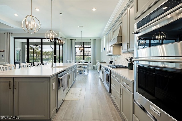 19720 Panther Island Blvd, Estero, FL 33928 - kitchen featuring a sink, gray cabinets, a notable chandelier, and stainless steel appliances