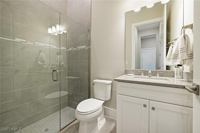 19720 Panther Island Blvd, Estero, FL 33928 - bathroom featuring vanity, toilet, baseboards, wood finished floors, and a stall shower
