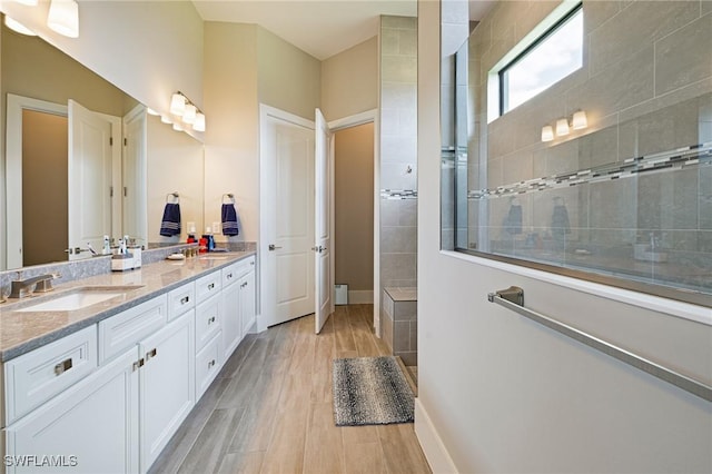 19720 Panther Island Blvd, Estero, FL 33928 - full bathroom featuring a sink, a walk in shower, double vanity, and wood finished floors