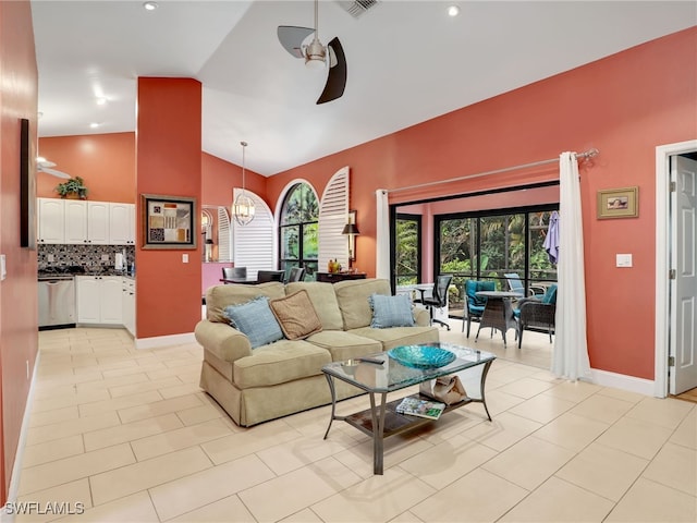 28796 Hunters Ct, Bonita Springs, FL 34135 - living room featuring baseboards, a ceiling fan, light tile patterned floors, and high vaulted ceiling