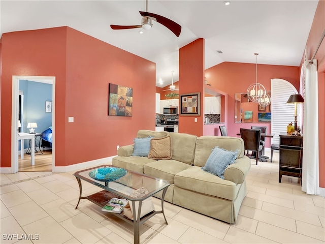 28796 Hunters Ct, Bonita Springs, FL 34135 - living area with baseboards, ceiling fan with notable chandelier, light tile patterned flooring, and vaulted ceiling