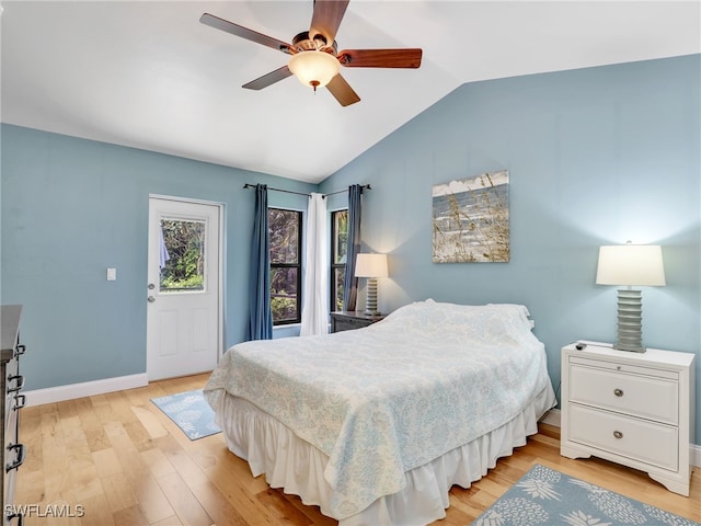 28796 Hunters Ct, Bonita Springs, FL 34135 - bedroom featuring light wood-type flooring, baseboards, ceiling fan, and vaulted ceiling