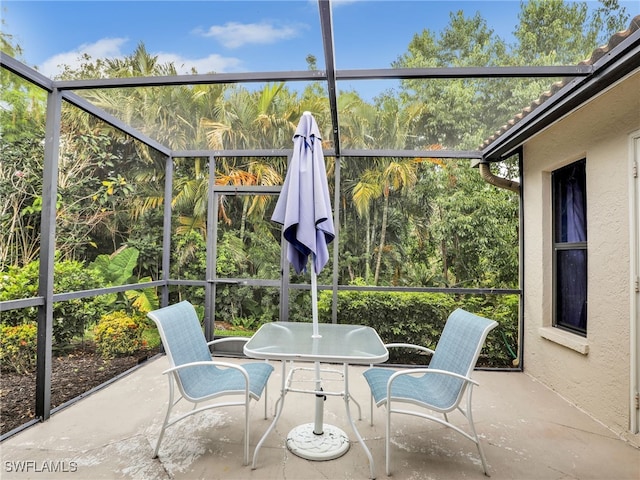28796 Hunters Ct, Bonita Springs, FL 34135 - unfurnished sunroom with outdoor dining space