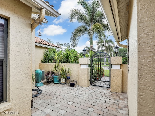 28796 Hunters Ct, Bonita Springs, FL 34135 - view of patio / terrace with a gate and fence