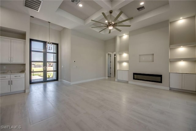 10 NW 13th Pl, Cape Coral, FL 33993 - unfurnished living room featuring baseboards, visible vents, ceiling fan, and coffered ceiling
