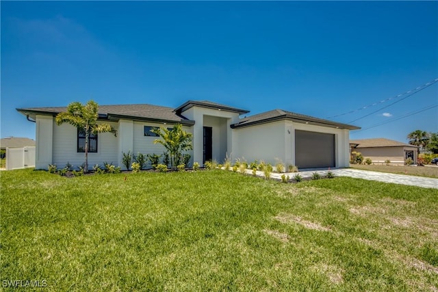 10 NW 13th Pl, Cape Coral, FL 33993 - prairie-style home with an attached garage, driveway, and a front yard