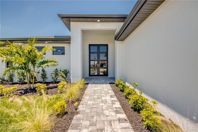 10 NW 13th Pl, Cape Coral, FL 33993 - entrance to property featuring french doors and stucco siding