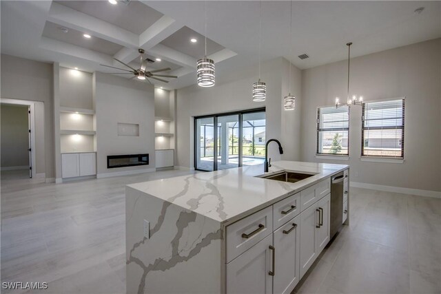 10 NW 13th Pl, Cape Coral, FL 33993 - kitchen featuring stainless steel dishwasher, baseboards, a sink, coffered ceiling, and ceiling fan with notable chandelier