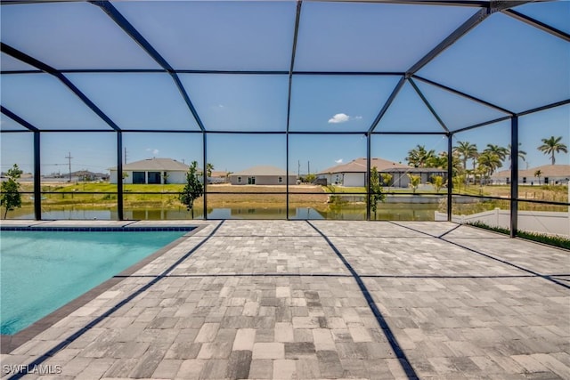 10 NW 13th Pl, Cape Coral, FL 33993 - pool featuring glass enclosure, a patio area, and a residential view