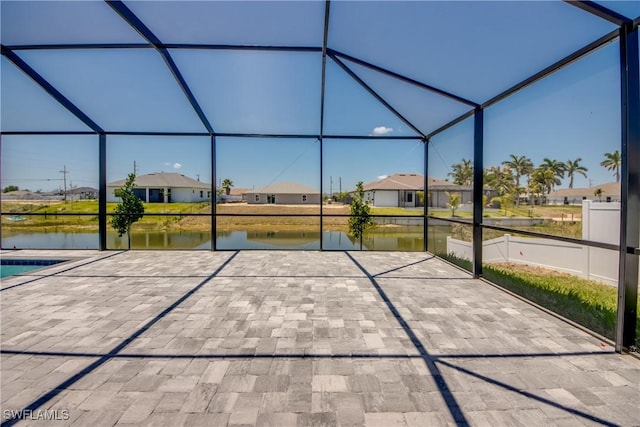 10 NW 13th Pl, Cape Coral, FL 33993 - view of patio with a residential view, glass enclosure, and a water view
