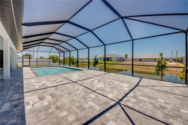 10 NW 13th Pl, Cape Coral, FL 33993 - pool featuring glass enclosure, a patio, a residential view, and a water view