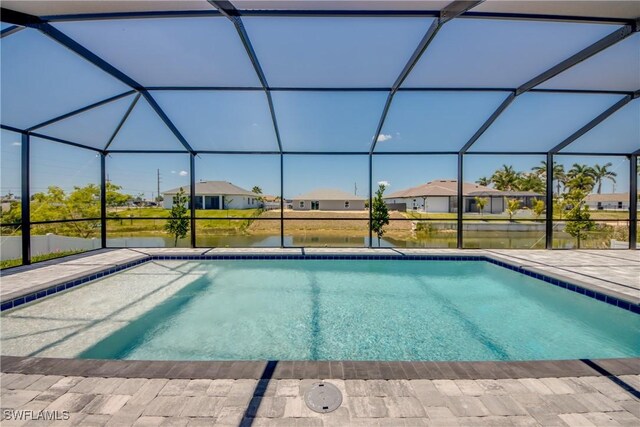 10 NW 13th Pl, Cape Coral, FL 33993 - outdoor pool featuring a residential view, a lanai, a water view, and a patio area