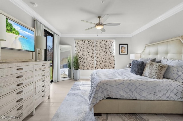 bedroom featuring ornamental molding, light wood-style flooring, and a ceiling fan