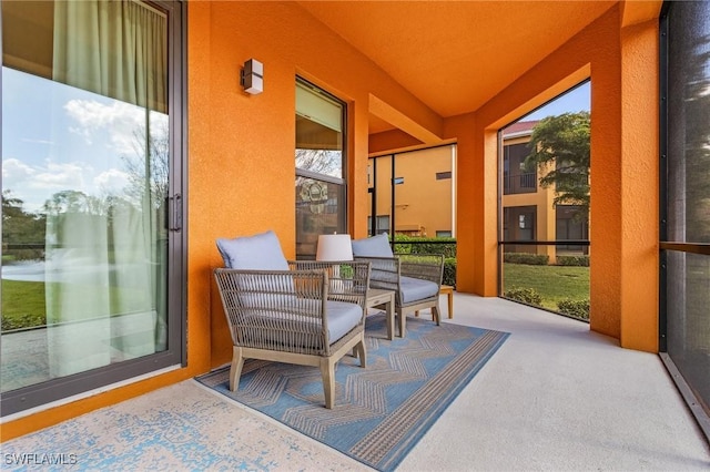 sunroom featuring carpet floors
