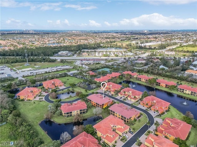 aerial view with a water view and a residential view