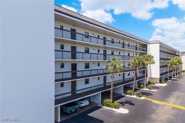 view of property featuring a parking lot