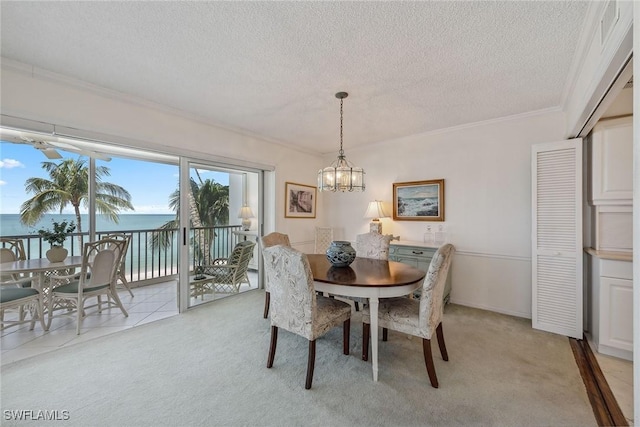 1275 Gulf Shore Blvd N Unit 301, Naples, FL 34102 - dining area with crown molding, a notable chandelier, and light colored carpet
