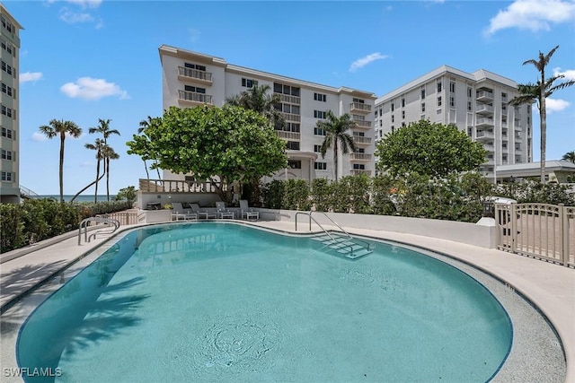 1275 Gulf Shore Blvd N Unit 301, Naples, FL 34102 - community pool with a gate and fence