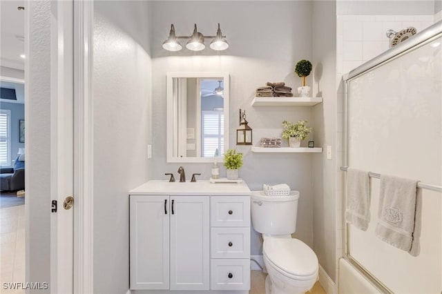 full bathroom with an enclosed shower, toilet, ceiling fan, and vanity