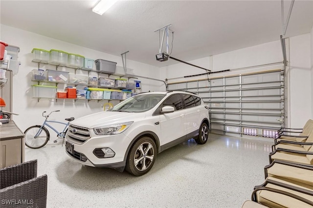 garage featuring a garage door opener