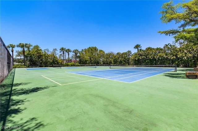 view of sport court with community basketball court and fence