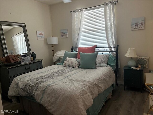 bedroom featuring wood finished floors