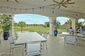 view of patio featuring outdoor dining area and a ceiling fan
