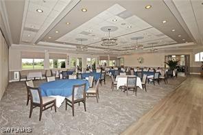 dining space with healthy amount of natural light, wood finished floors, and recessed lighting