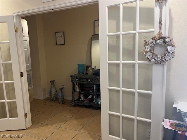 corridor featuring light tile patterned flooring