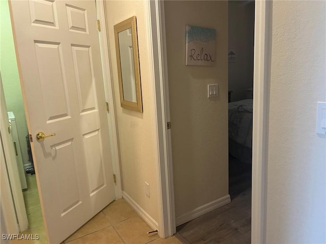 9631 Spanish Moss Way Unit 3931, Bonita Springs, FL 34135 - hall with a textured wall and light tile patterned floors