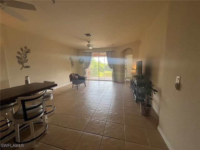 9631 Spanish Moss Way Unit 3931, Bonita Springs, FL 34135 - living area featuring a ceiling fan, tile patterned floors, and arched walkways