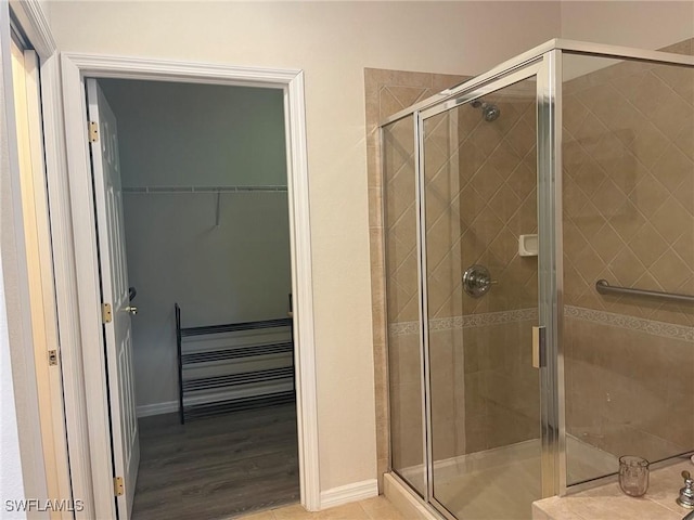 9631 Spanish Moss Way Unit 3931, Bonita Springs, FL 34135 - bathroom with a stall shower and a walk in closet