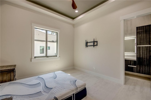 bedroom with baseboards, ensuite bathroom, and recessed lighting